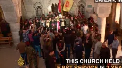 Feiernde Christen in ihrer von den Islamisten befreiten Kirche.  / Al Jazeera (YouTube) via ChurchPOP