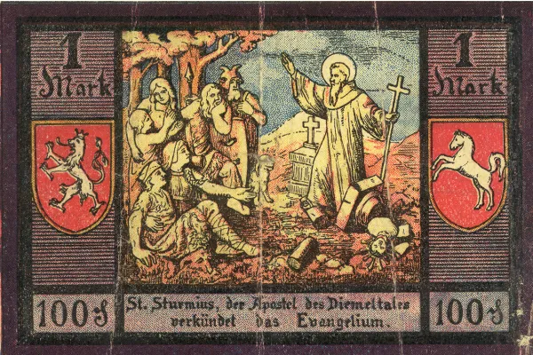 Abbildung des hl. Sturmius auf Notgeld der Stadt Niedermarsberg (1921): „St. Sturmius, der Apostel des Diemeltales, verkündet das Evangelium“. / Gemeinfrei