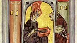 Hildegard von Bingen empfängt eine göttliche Inspiration und gibt sie an ihren Schreiber weiter / gemeinfrei