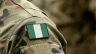 Nigerianische Flagge auf der Uniform eines Soldaten / Shutterstock